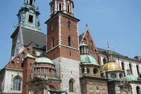 Beautiful and colorful church and other buildings in sunlight, under the blue sky, in Krakow, Poland