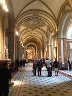 people in the interior of the catholic church