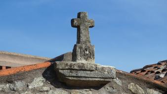 stone cross on the roof of a church in Fatima, Portugal