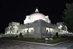 Night view of the Buddha Vihar in Gulbarga, Karnataka, India, among the plants, on landscape