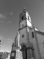 Black and white photo of the beautiful church and statue in Fatima, Portugal