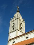 Beautiful and colorful church steeple in Fatima, Portugal, under the blue sky