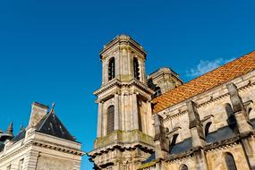 Beautiful and colorful Langres cathedral in France, under the blue sky with white clouds