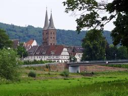 church with spiers near the forest