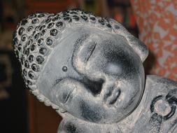 Close-up of the stone statue of Buddha