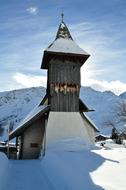 Beautiful, snowy landscape with church, on the Swiss Alps in Switzerland