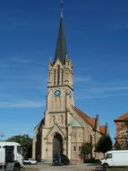 Beautiful and colorful Schutzengelkirche church in Bruehl, Germany, in sunlight, at blue sky with clouds on background