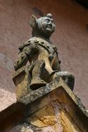 Colorful statue on the church in Ambierle, France