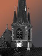 church roof with spiers at dusk