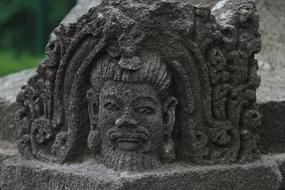 male Face, traditional asian stone carving