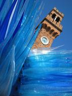 Beautiful Murano sculpture among the blue shapes of different shades, clipart