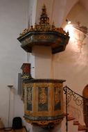 Beautiful and colorful, patterned pulpit in St Franziskus Church, with lights