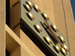 vintage golden clock on church facade