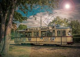 painted vintage tram against the evening sky