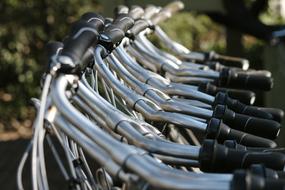 handlebars of parked bicycles