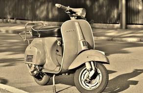 vintage Vespa Scooter parked on roadside