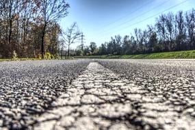 micro cracks on an asphalt country road