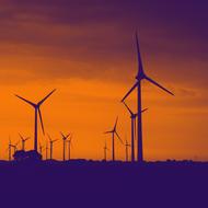photo of wind turbines on an orange sunset background