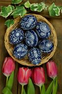 bouquet of tulips and dark blue easter eggs with a pattern