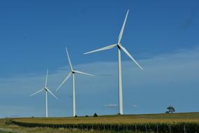 powerful electric turbines along the arable field