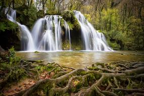 scenic Waterfall in forest at autumn