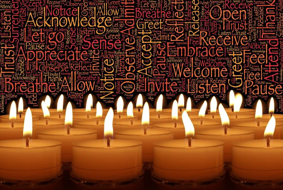 burning candles on the background of texts