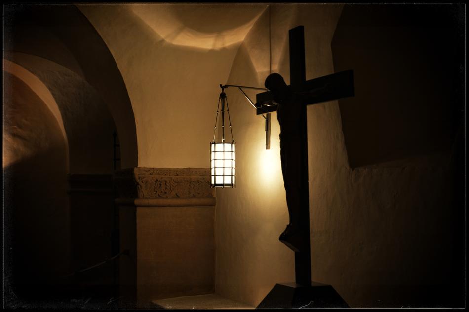 lamp above the cross with a crucifix in the interior