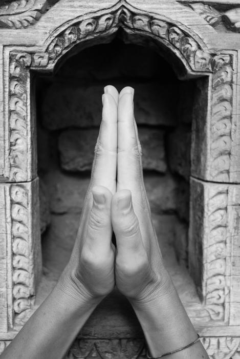 prayer’s hands in temple, Nepal