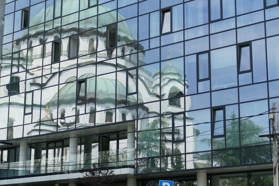 temple is reflected in the mirrored facade in belgrade