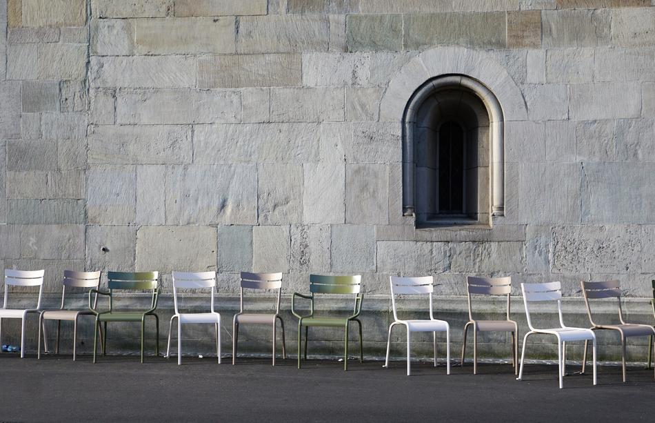 chairs near the church wall in zurich