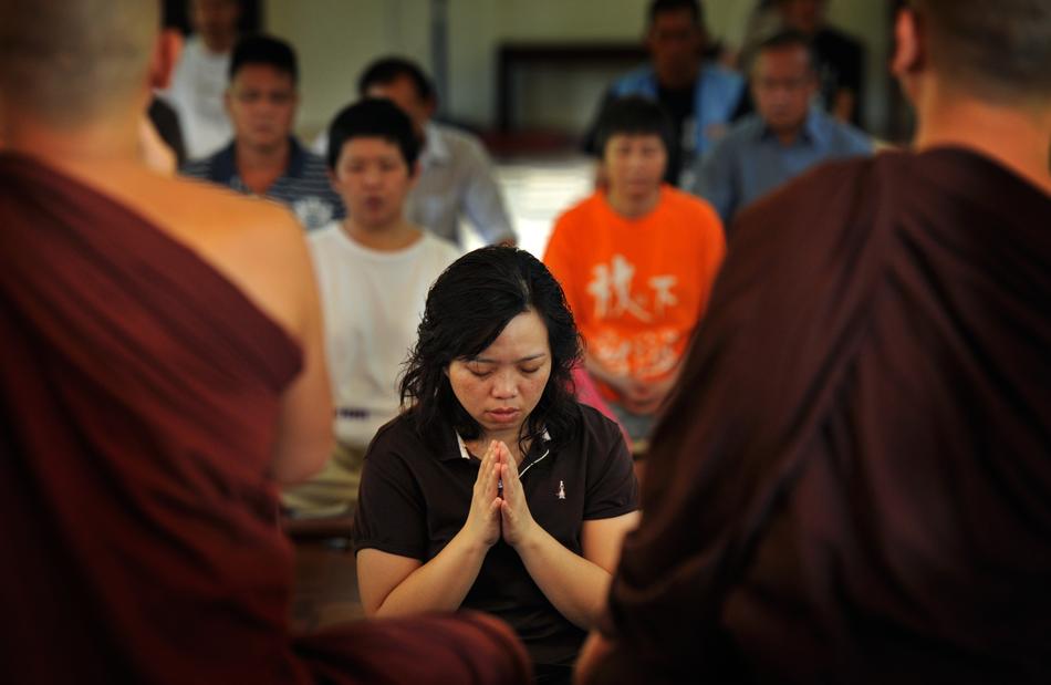 prayer in buddhism in blurred background