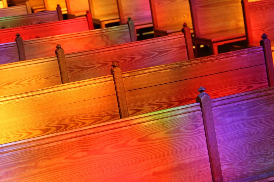 Beautiful and colorful, gradient church pews in the church