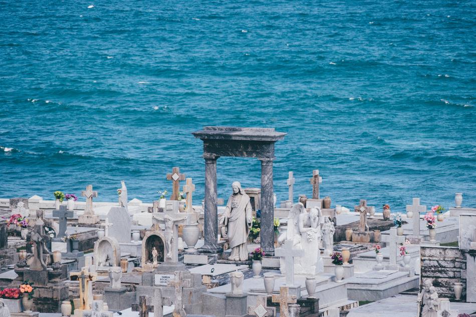 Beautiful Catholic cemetery, on the shore with turquoise water