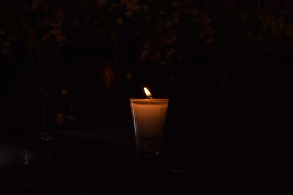 Sailing Visitation candle at dark