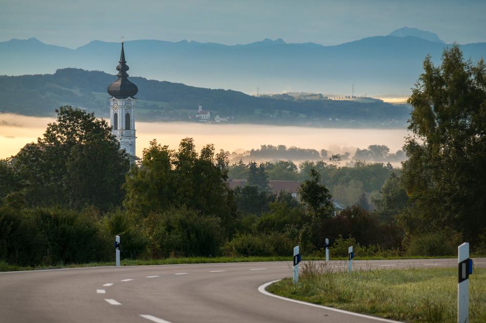 Beautiful road in Diessen, near the Ammersee in fog, Bavaria, Germany