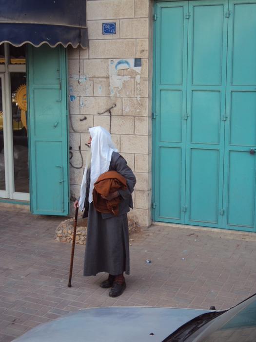 Old man, walking on the street of Palestone, on the Middle East