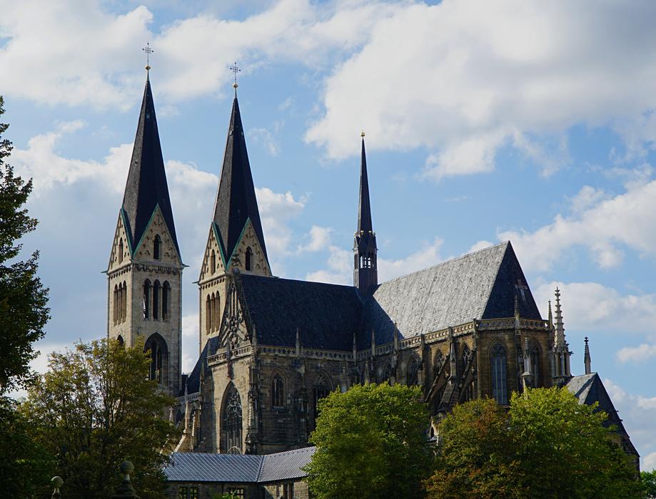 Beautiful church among the colorful trees, in Halberstadt, Germany
