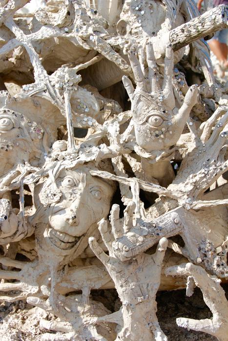 Hands Face Death stone statues