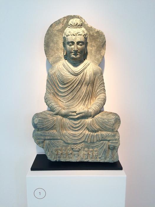 sculpture of buddha on pedestals