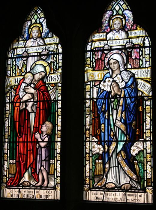 Colorful and beautiful stained glass windows with St Mary, in the church