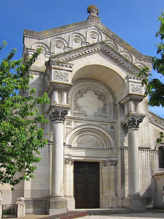Beautiful, decorated Basilica of St Martin, among the green trees in Tours, France
