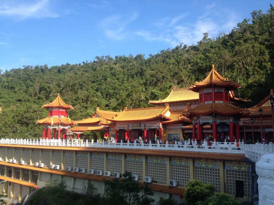 Beautiful and colorful Three Clear Total Temple in Ilan, Taiwan, among the green trees