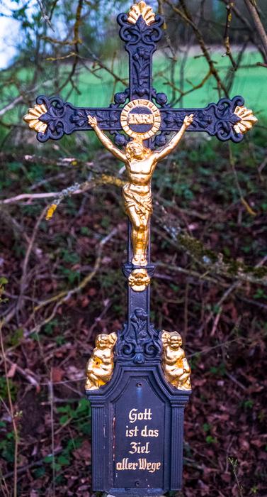 cross with jesus christ near the road