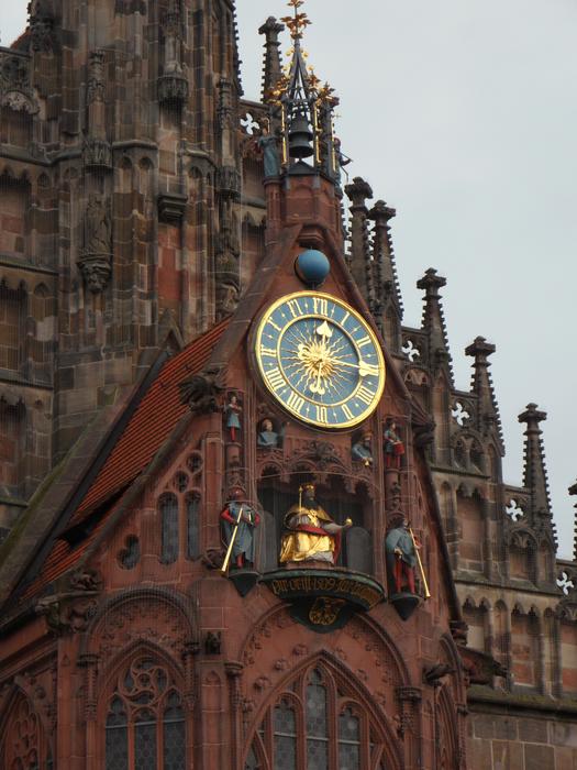 Gold clock at Frauenkirche in Nuremberg, Germany
