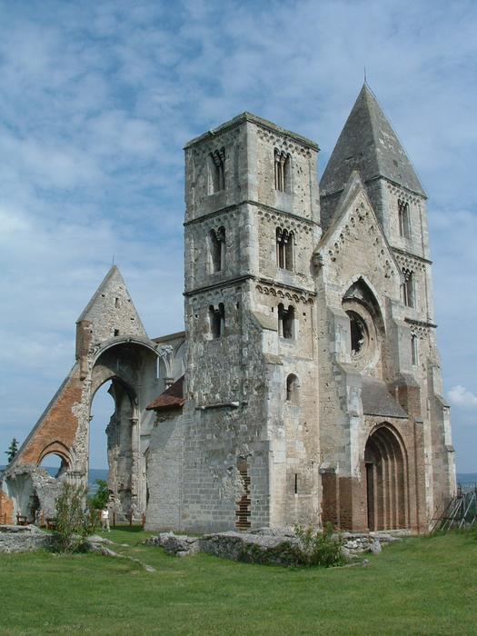 Beautiful landscape of the Zsámbék Church among the green grass, in Zsámbék, Hungary, under the blue sky with white clouds