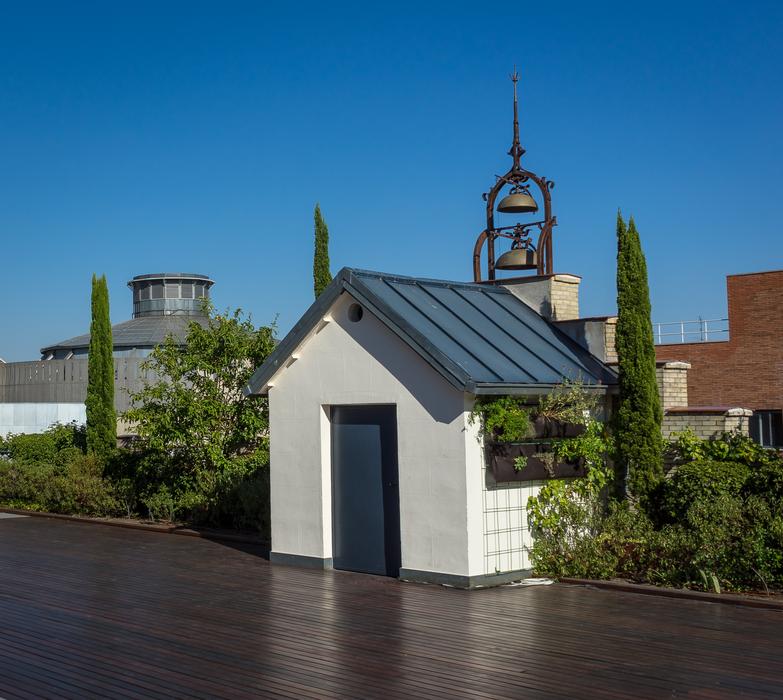 Beautiful landscape with cabin, near the bells, among the plants, under the blue sky, in Torres, Spain