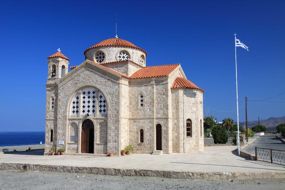 flag near the church in greece