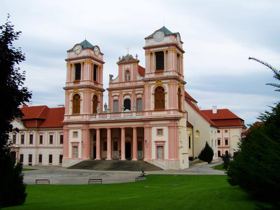 Beautiful and colorful GÃ¶ttweigi Abbey, among the green plants in Lower Austria