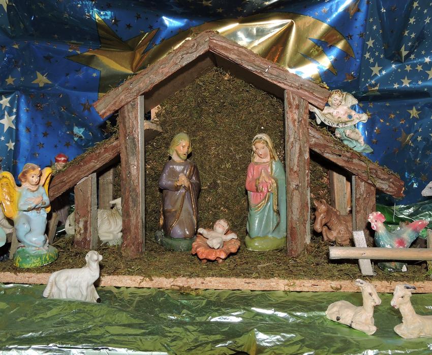 nativity scene for christmas on a background of blue fabric