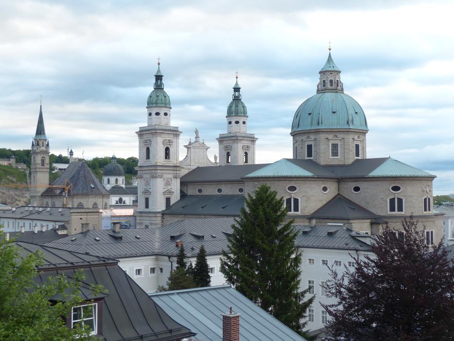 Beautiful Salzburg cathedral with the green trees